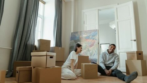 Couple surrounded by storage boxes.